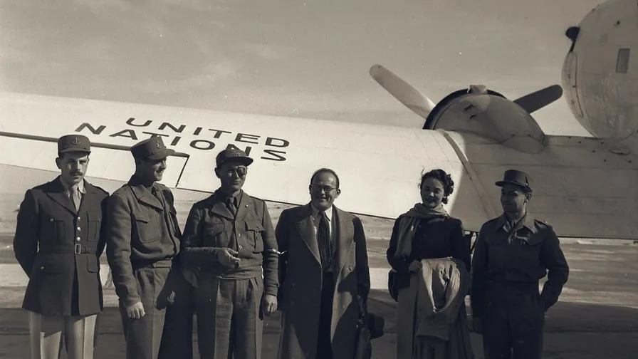 Members of Israel's delegation beside a United Nations aircraft, leaving for armistice talks with Jordan, 1949.