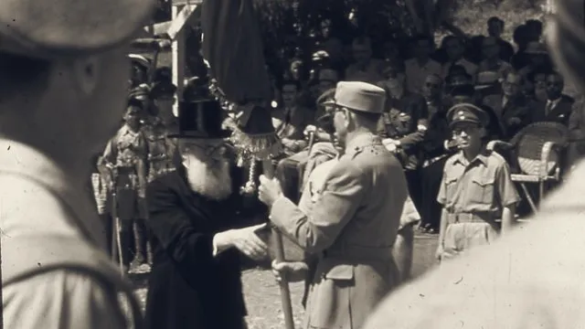 Officers and a rabbi with a banner at the Jerusalem ceremony founding the Israel Defense Forces, June 1948.