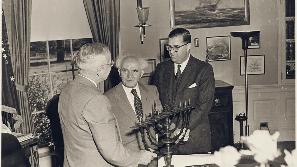 David Ben-Gurion and Abba Eban present a menorah to President Harry Truman in the Oval Office, May 1951.