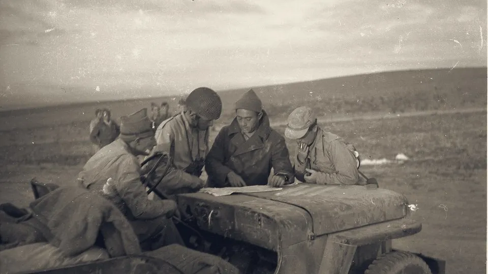 IDF officers study a map on a jeep as forces move south before Operation Yoav, 13 October 1948.